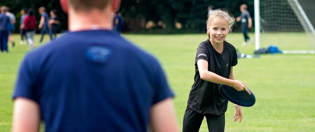 Girl throwing a frisbee