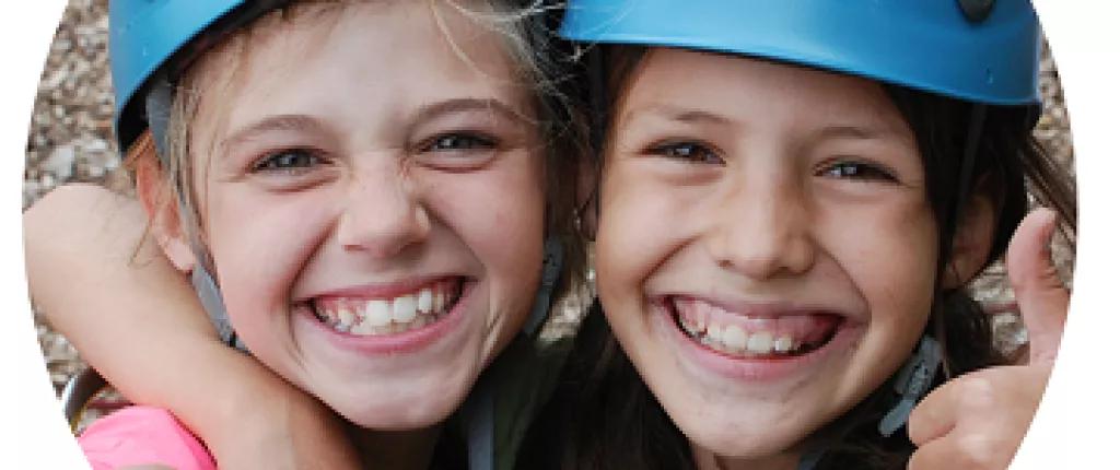 Two girls rock climbing