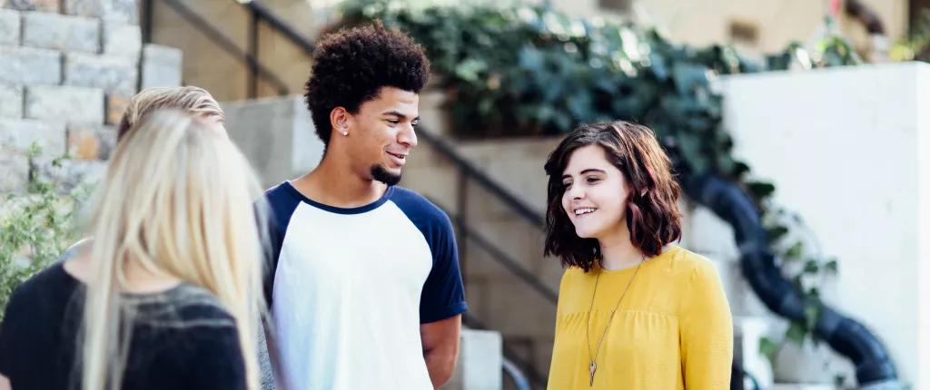 three-young-people-talking
