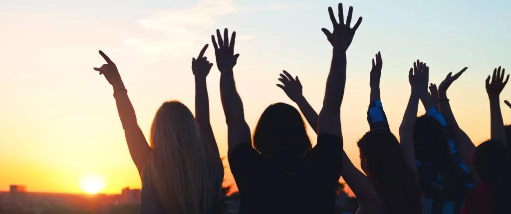 Hands in the air with sun