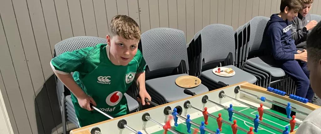 Boy playing table football