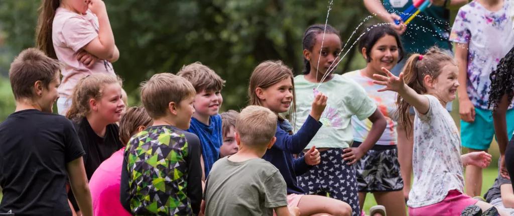 Group of kids sat down playing