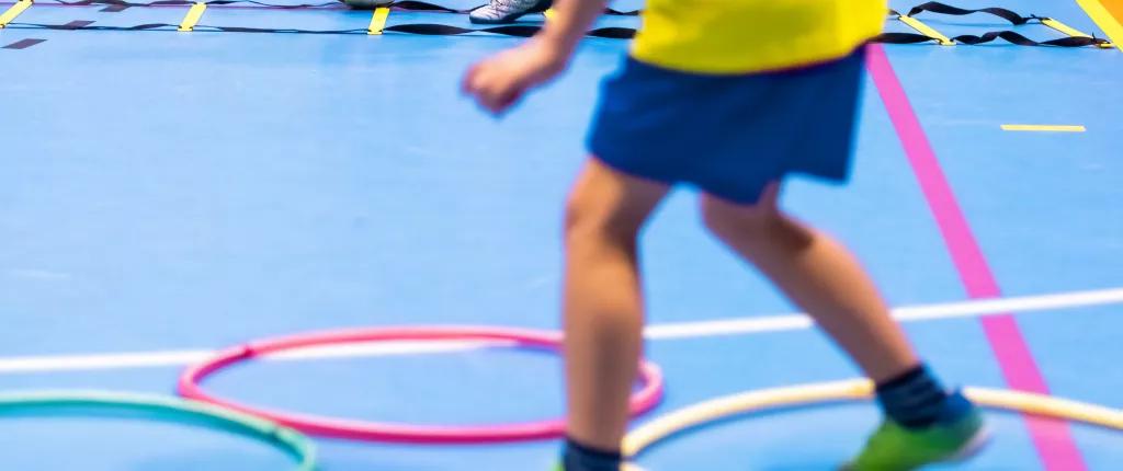 children completing obstacle course