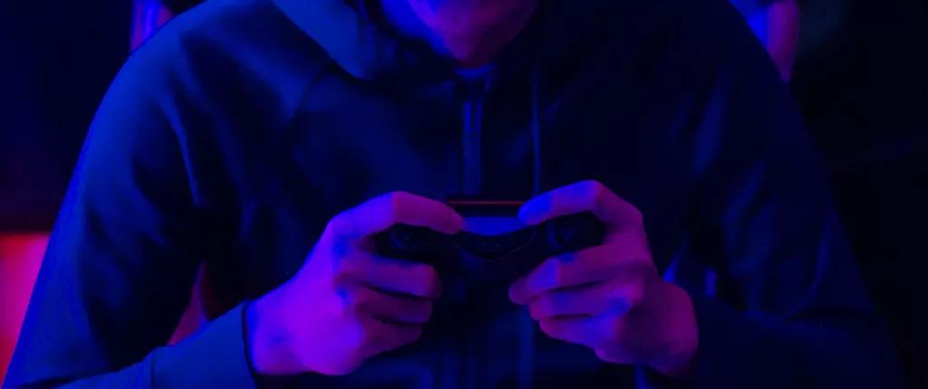 Youth with a games console