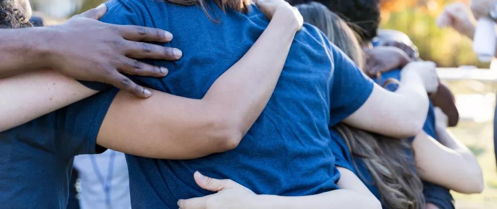 Volunteers hugging