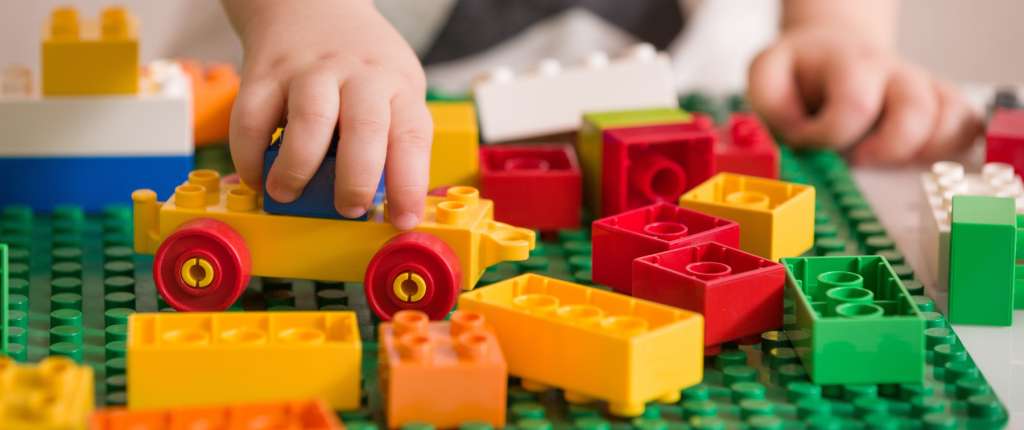 Child playing with duplo