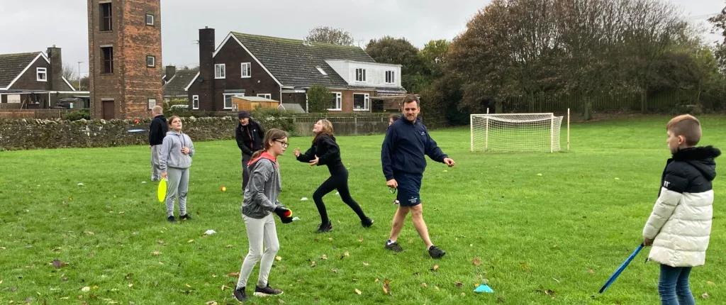 children playing sport with sports team