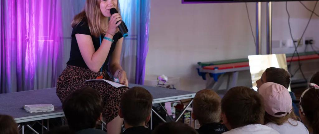 Young leader talking with microphone