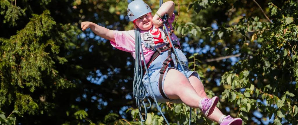 A girl on a zipline.