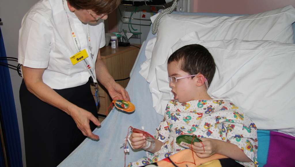Boy in hopsital receving his Bauble Books gifts