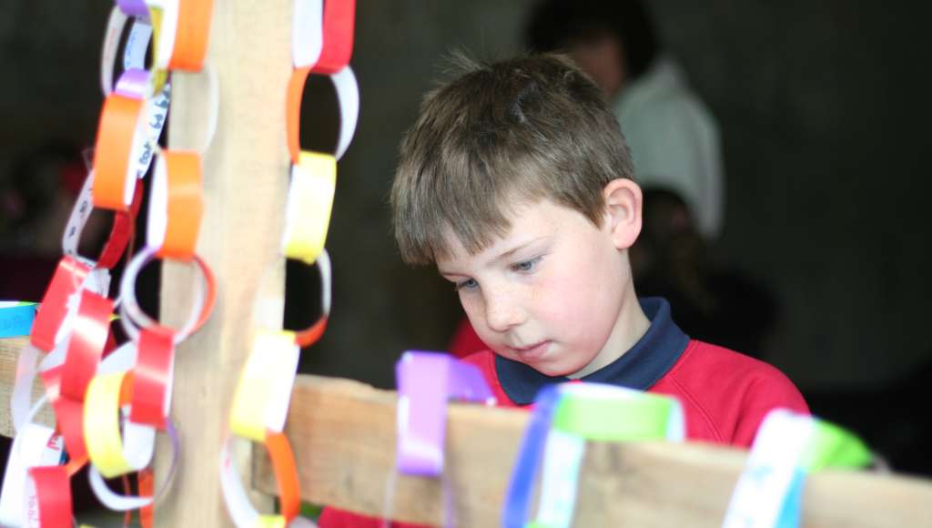 Boy and cross at Lifepath Boy and cross at Lifepath