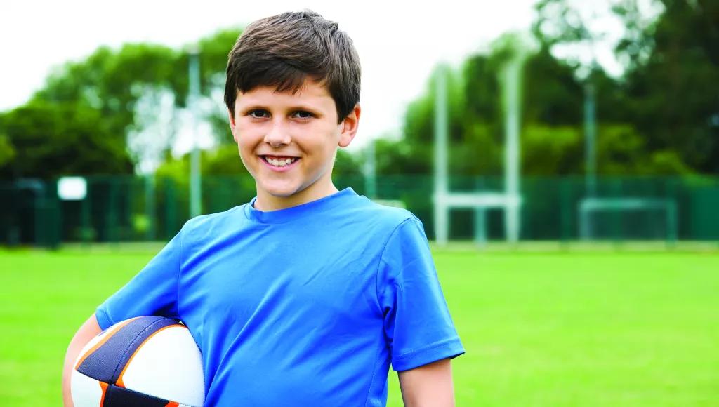 Boy - blue t-shirt - ball