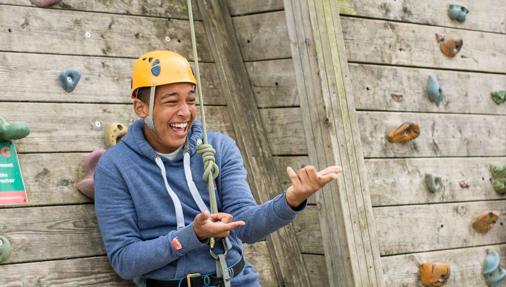 Boy laughing and pointing