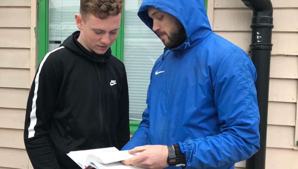 Luke receiving a Bible