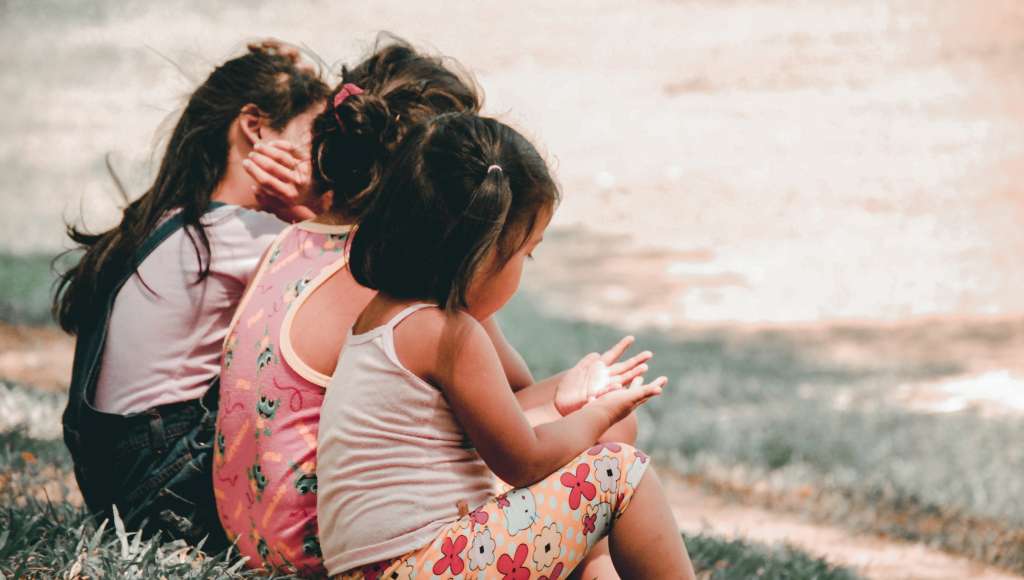 Three children sitting
