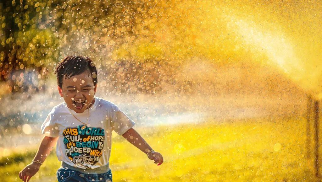 Boy with sprinkler