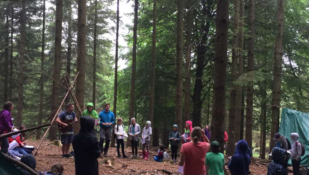 Go Wild holiday children building a shelter in the wood
