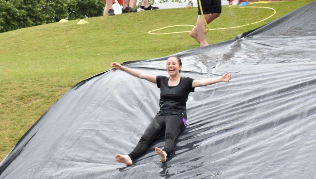Submerge holiday girl on water slide