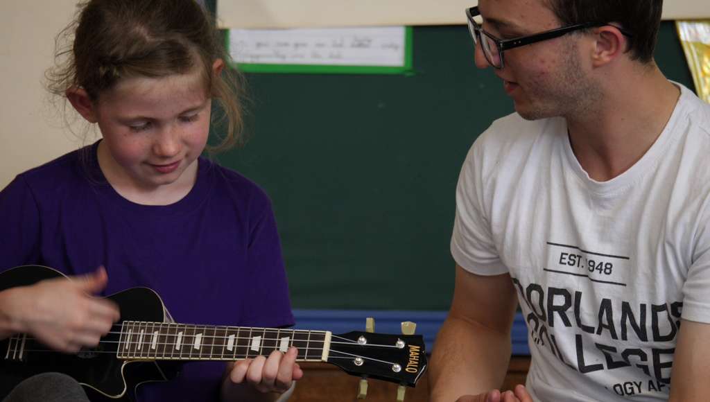 Girl playing ukulele