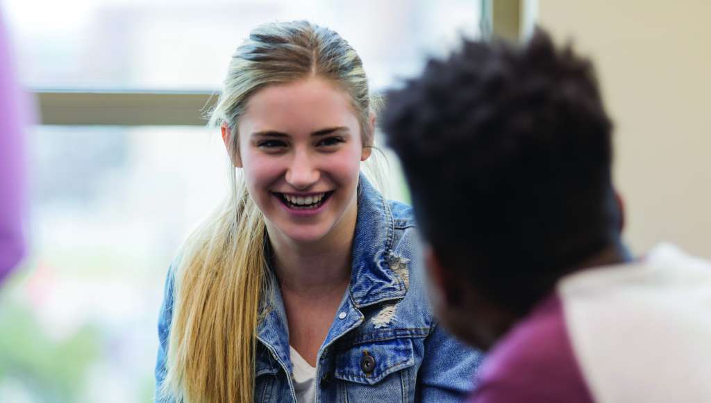 Two young people chatting