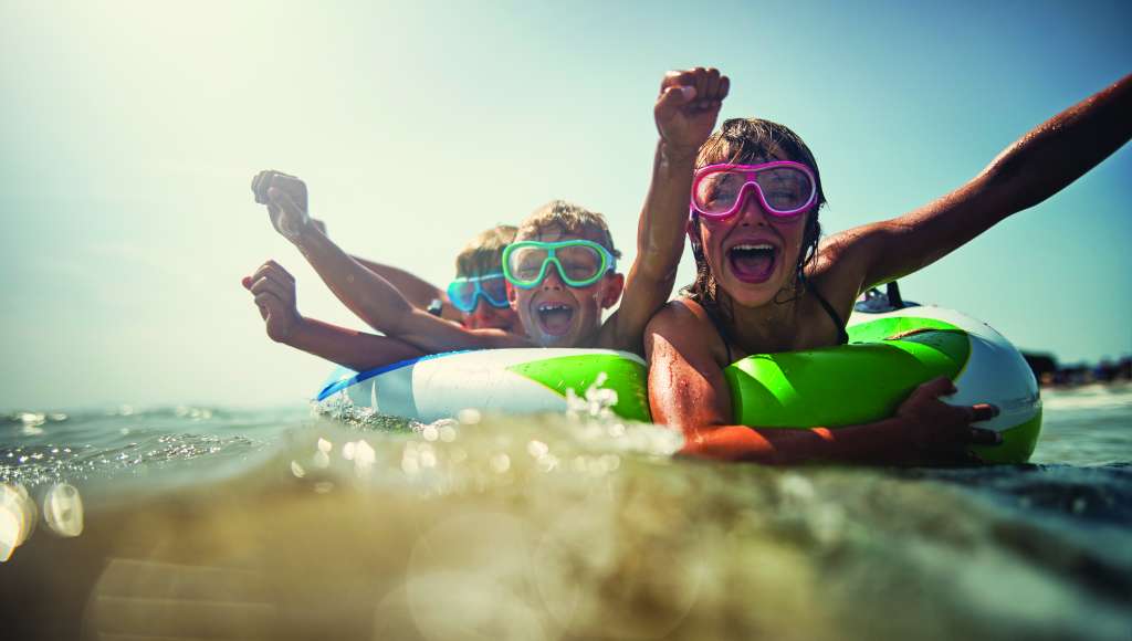 Three children in the sea