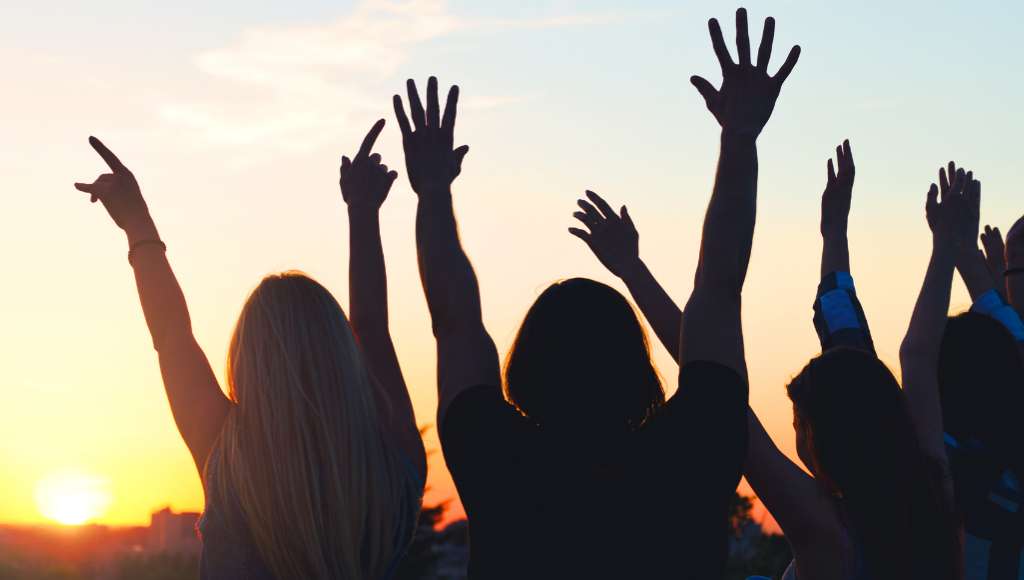 Hands in the air with sun