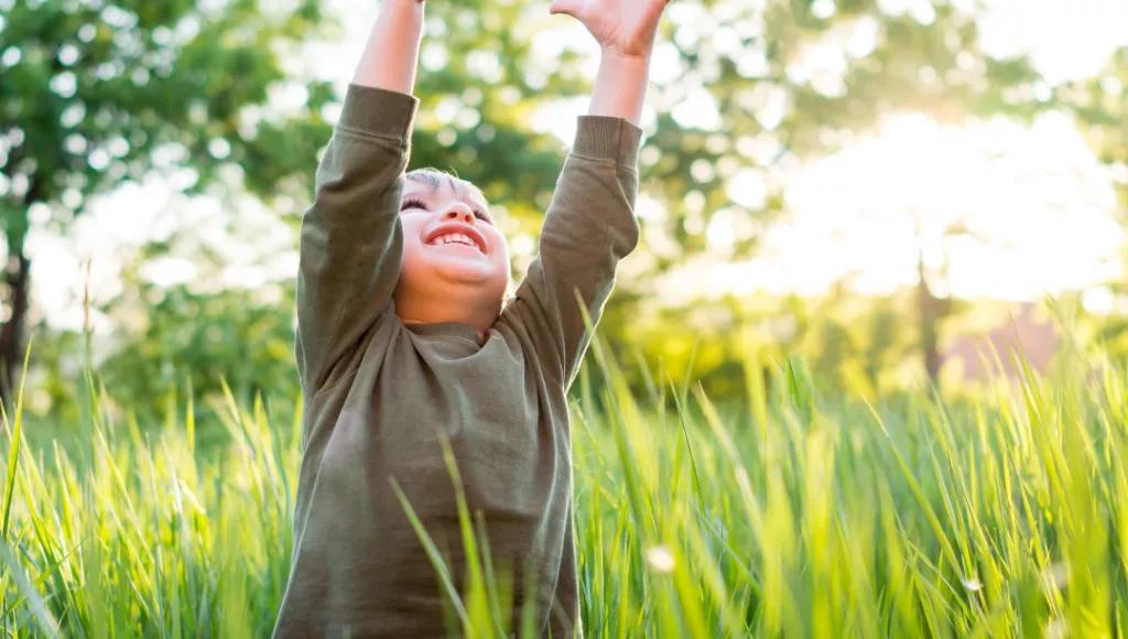 Child reaching to the sky