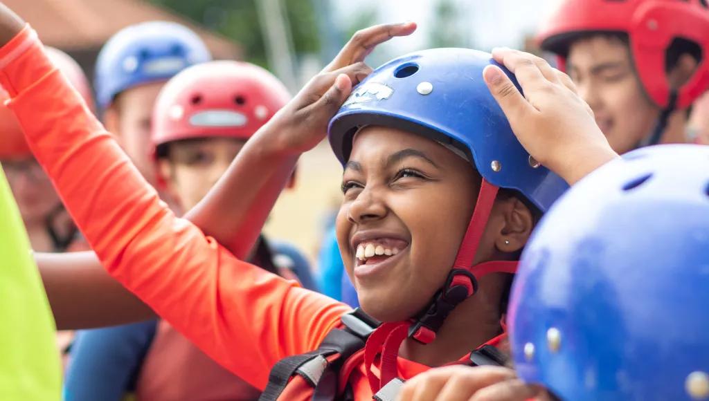 child smiling with helmet