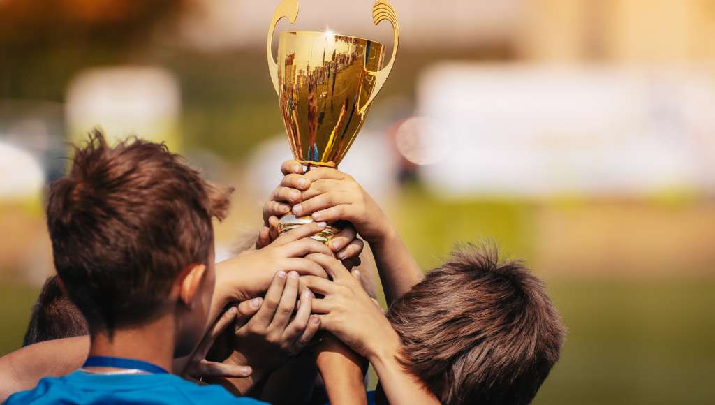 Trophy lifted by children