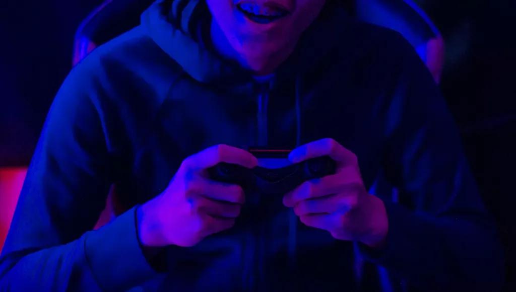 Youth with a games console