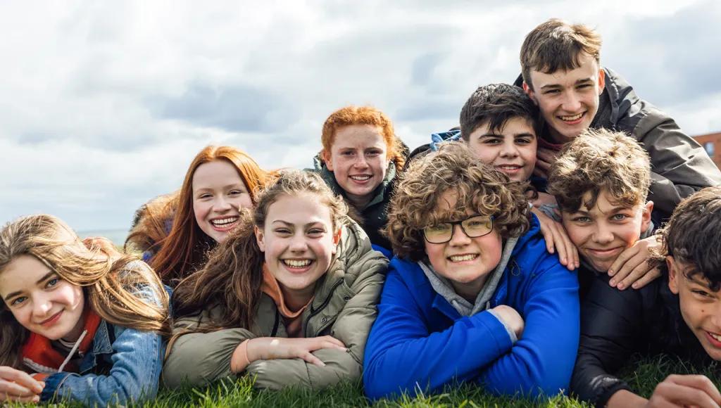 Group of teenagers on the grass