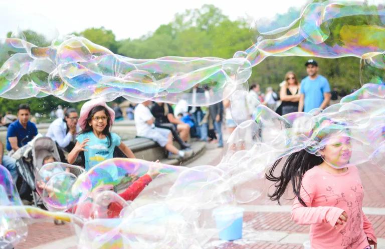 Children playing with bubbles