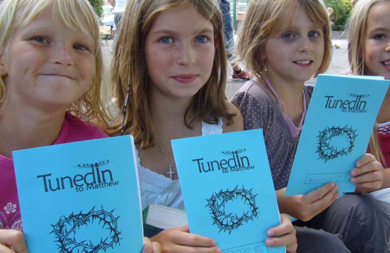 Children with Bible booklets