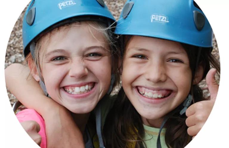Two girls rock climbing