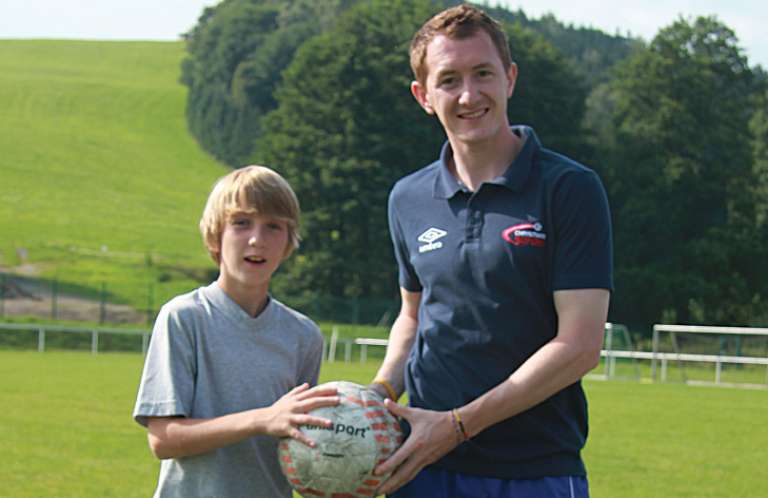 Holding a football Holding a football