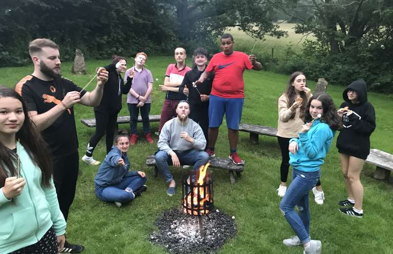Rooted residential camp fire
