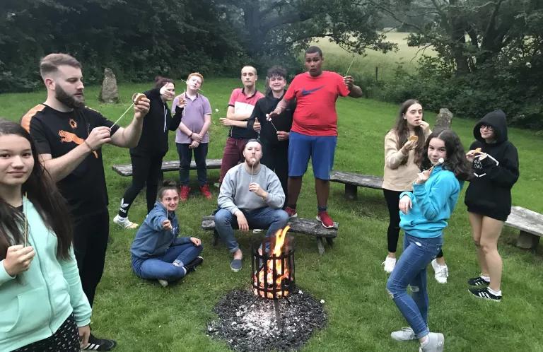 Rooted residential camp fire