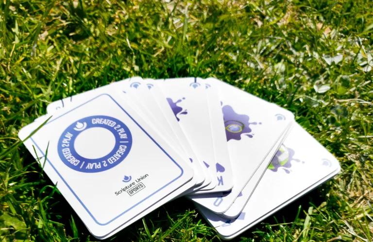 Created2Play cards on a field