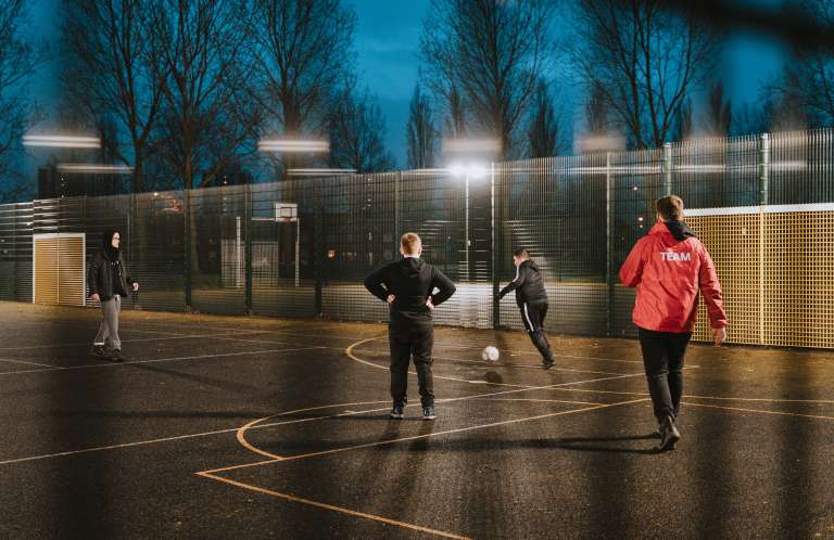 young people playing football