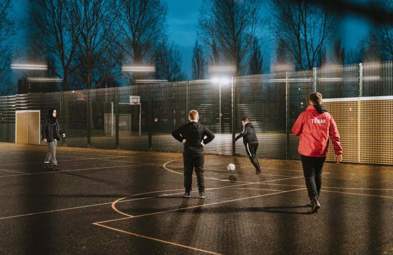 young people playing football