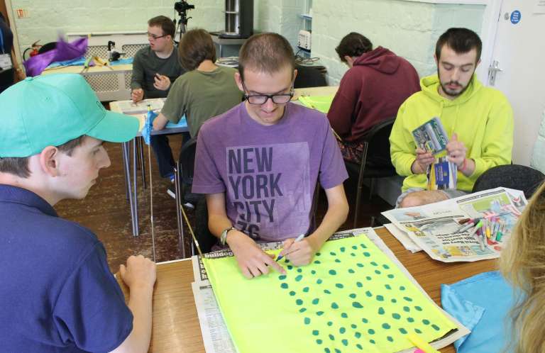 Three males doing group activity