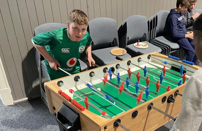 Boy playing table football