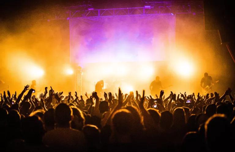 Youth arms in air
