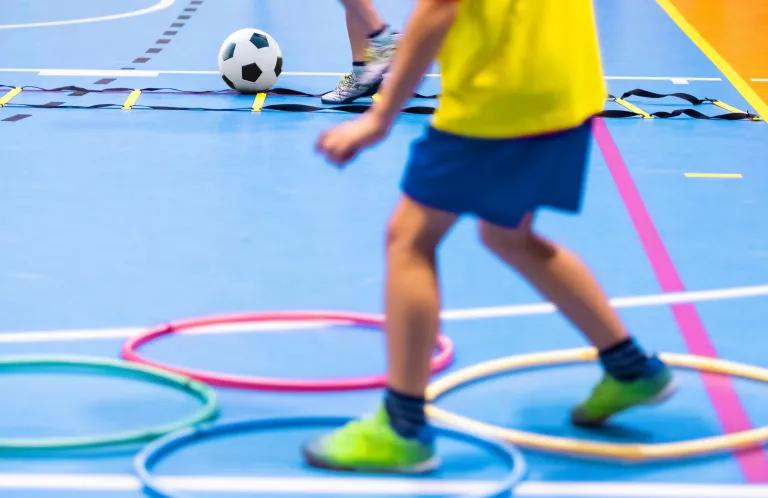children completing obstacle course
