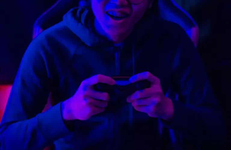 Youth with a games console