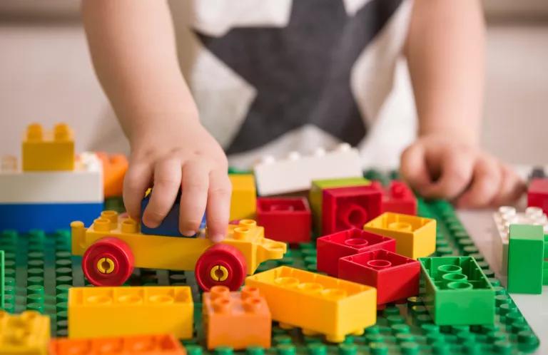 Child playing with duplo