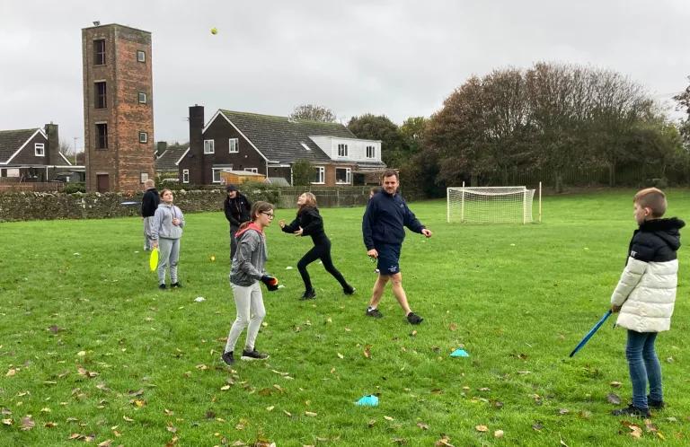 children playing sport with sports team