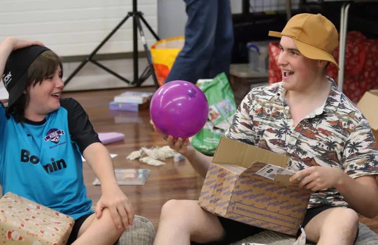 Young leader playing game with child