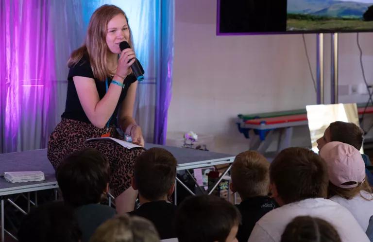 Young leader talking with microphone