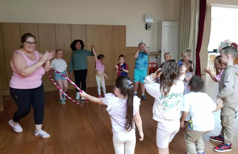 Children and leaders playing in a circle